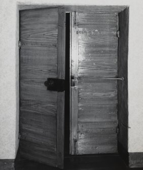Interior.
Detail showing rear face of twin leaf door into long gallery.