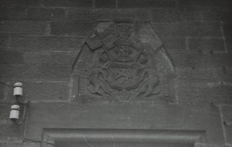Detail showing heraldic panel from NW.
