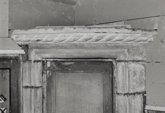 Interior.
Detail of door surround in cap house.