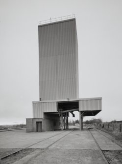 Exterior view from N of rail dispatch silo/hopper and siding, sitated to SW of maltings