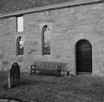 View of windows and doorway on S wall from SE.