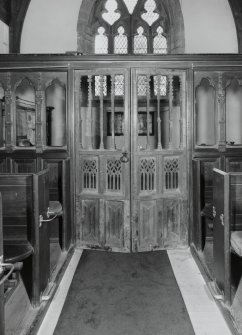 Interior.
View of traceried doors in screen.
