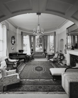 Interior.  Ground floor, living room, view from arched opening from library.