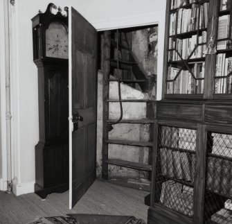 Interior.  Upper floor, view of doorway opening onto attic stair.