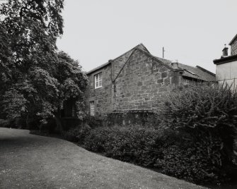 View of N wall and N outbuilding from N.