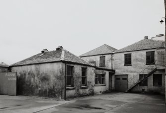 View of former gate house and customs and exercise house from SW.