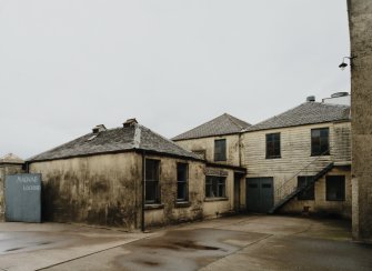 View of former gate house and customs and exercise house from SW.