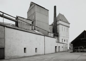 General view of water tower, boiler-house/brew-house and chimney from E.