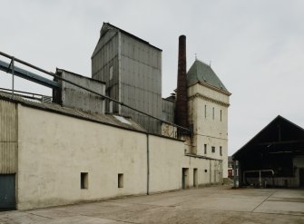 General view of water tower, boiler-house/brew-house and chimney from E.