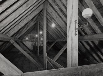 Interior.
View of king post roof structure including gas light fitting.