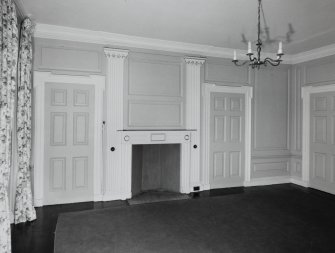 Interior. Ground floor View of drawing room from SSWInterior. Ground floor View of drawing room from SSW showing 18th century paneling, giant pilasters and early 19th century fireplace