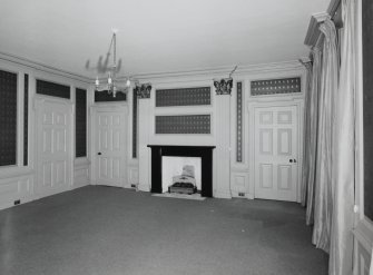 Interior. Ground floor View of the Central Saloon from NNW showing 18th century paneling, giant corinthian pilasters and early 19th century fireplace
