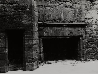 View of hall fireplace and entrance to turret.