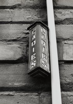 Detail of ladies WC sign.