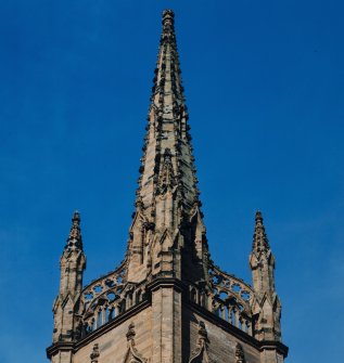 View of spire with wallhead parapet and pinnacles.