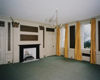 Interior. Ground floor View of the Central Saloonl from NE showing 18th century paneling, giant corinthian pilasters and early 19th century fireplace
