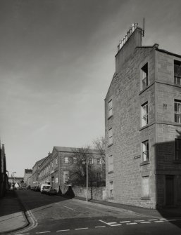 General view of Kemback Street from South showing warehouses on West side of works.