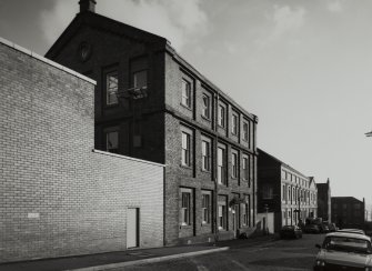 General view of Kemback Street from North-West showing warehouses (right) on West side of works.