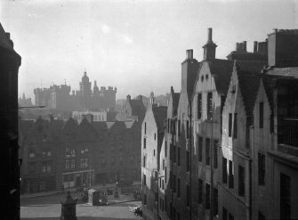 General view taken from Victoria Terrace of part of west side of West Bow, south side of Grassmarket and George Heriot's Hospital School in the distance.