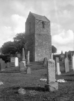 View of gravestones and tower.