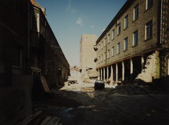 General view from South inside yard of Mill, showing site of demolished preparing shed.