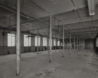 Second Floor (3rd Flat):  Interior view from SE within central portion of mill, showing lateral vaults of ceiling, cast-iron columns and beams, and flagstone floor