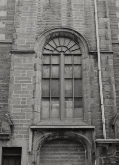 Detail of arched window over original entrance