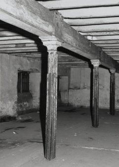 Exchange Street Building. Interior.
General view of second floor, West half of block, showing typical flanged columns for slotted partitions. Columns are 0.12m dia at 3.25m centres, having cast-iron saddles on top for wooden beams.