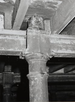 Exchange Street Building. Interior.
Detail of round cast-iron column in basement in East half of block. The cast-iron columns are in three rows, are 0.21m dia at 2.7m centres. The column tops carry cast-iron saddles holding 'I' section cast-iron cross beams as elsewhere.