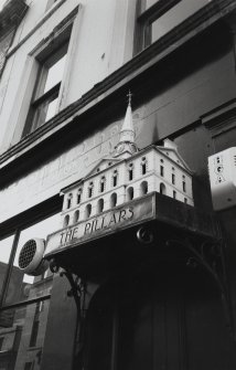 Detail of model Townhouse above entrance to bar.