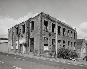 General view from SE showing S and E side of building, emphasising its extremely derelict condition