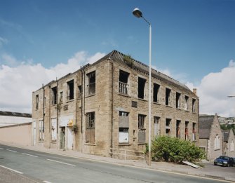 General view from SE showing S and E side of building, emphasising its extremely derelict condition