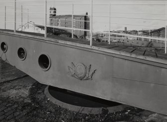 Detail showing cast-iron 'Dundee Harbour' crest on footbridge