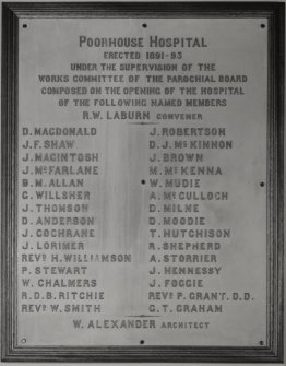 Interior. Patients dining room. Detail of memorial plaque with inscription "Poorhouse Hospital. Erected 1891-93. Under the Supervision of the Works Committee of the Parochial Board Composed on the Opening of the Hospital of the Following Named Members [...] W.Alexander Architect"