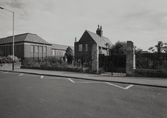 View of South gates and Janitors house from South West