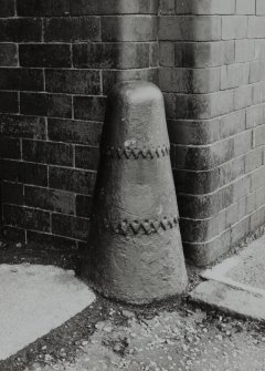 Detail of cast-iron bollard protecting flanks of entrance to Bond from Trades Lane.