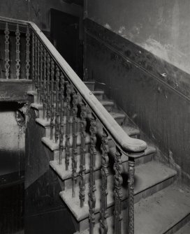 Interior.
Detail of staircase and dado panelling in rear (South-West) block.