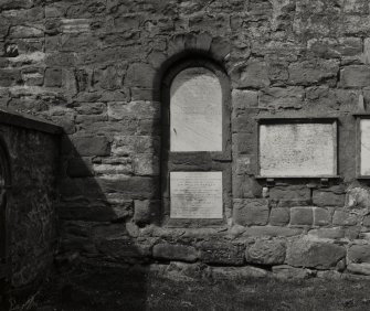 View of capel door filled in with tombstone.