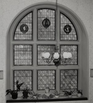 Interiorview of Archerfield House. Stair hall stained glass window