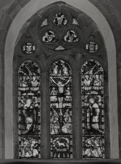 Interior. Chancel E stained glass window depicting the crucifiction