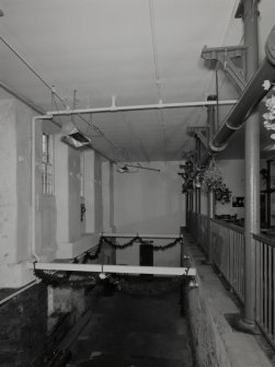 Interior. View in W side of mill showing cast-iron columns (right)
