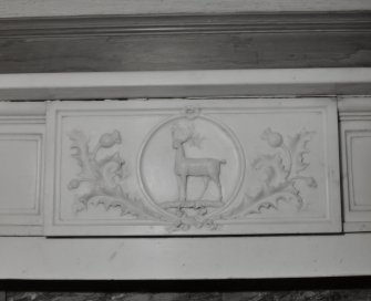 Interior. First Floor drawing room, detail of fireplace showing stag and thistle panel