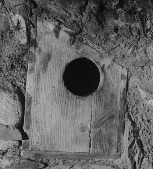 Interior: Detail of salt box in mid wall next to E hanging chimney