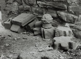 Architectural fragments from the abbey church, held under the arch of the gate-house; include mouldings of thirteenth-century types