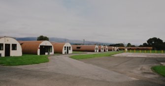 View from SW of R & F accommodation (huts 41-43, 61-5), NAAFI (65)