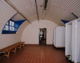 Interior view of officers ablutions (hut 22) showing shower cubicles