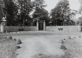 View of gates and curved wall from East.