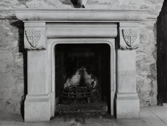 Ground floor, vaulted room, detail of fireplace..