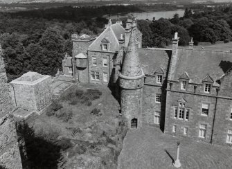 View of North end of house with entrance turret from parapet of keep to West.