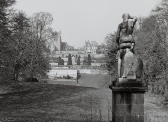 View of statue with castle in the distance from South West.